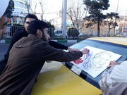 تصاویر/ ماشین نویسی و نصب تصاویر سپهبد سلیمانی توسط طلاب
