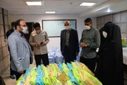 تصاویر/ افتتاح پنجمین کارگاه دوخت ماسک تنفسی و لباس مدافعان سلامت در همدان