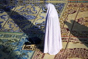 Why should women cover themselves in prayers?