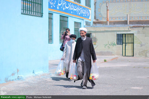بالصور/ مساعدات مدرسة الإمام الحسن المجتبى (ع) العلمية بمدينة بيرجند شرقي إيران