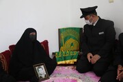 تجلیل خدام رضوی از خانواده کم سن ترین شهید بوشهر