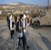 Israeli forces, settlers assault student in West Bank village