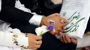 Tens of migrant couples celebrate marriage in Imam Reza holy shrine