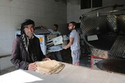 تصاویر/ توزیع ۳۲ هزار قرص نان صلواتی به نیت حاج قاسم در کردستان