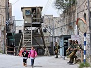 Israeli soldiers join settlers in forcing Palestinian shops to close down