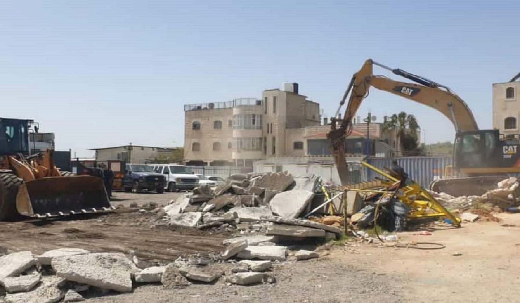 Palestinians demonstrate at the West Jerusalem Israeli municipality against its demolition policy