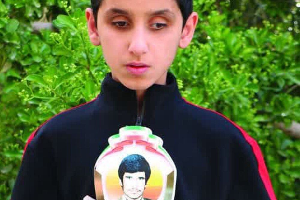 اهدای تندیس «پهلوان ناصر علی» به نوجوان موذن اشکذری 