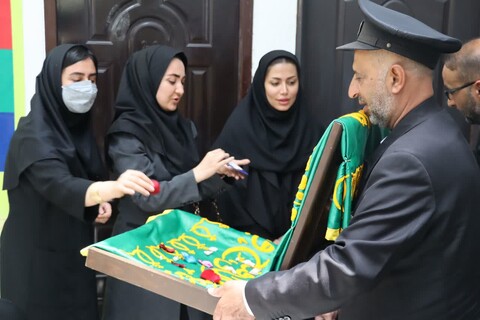 تبرک اصحاب رسانه بوشهر به پرچم حرم رضوی