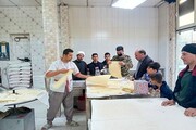 پخت و توزیع نان نذری به نیت امام مجتبی(ع) در کرمانشاه