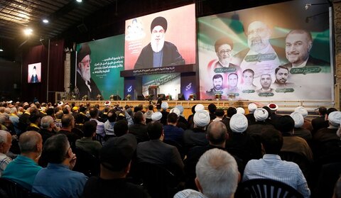 الاحتفال التكريمي الذي أقامه حزب الله للشهداء الأبرار الرئيس الإيراني ورفاقه