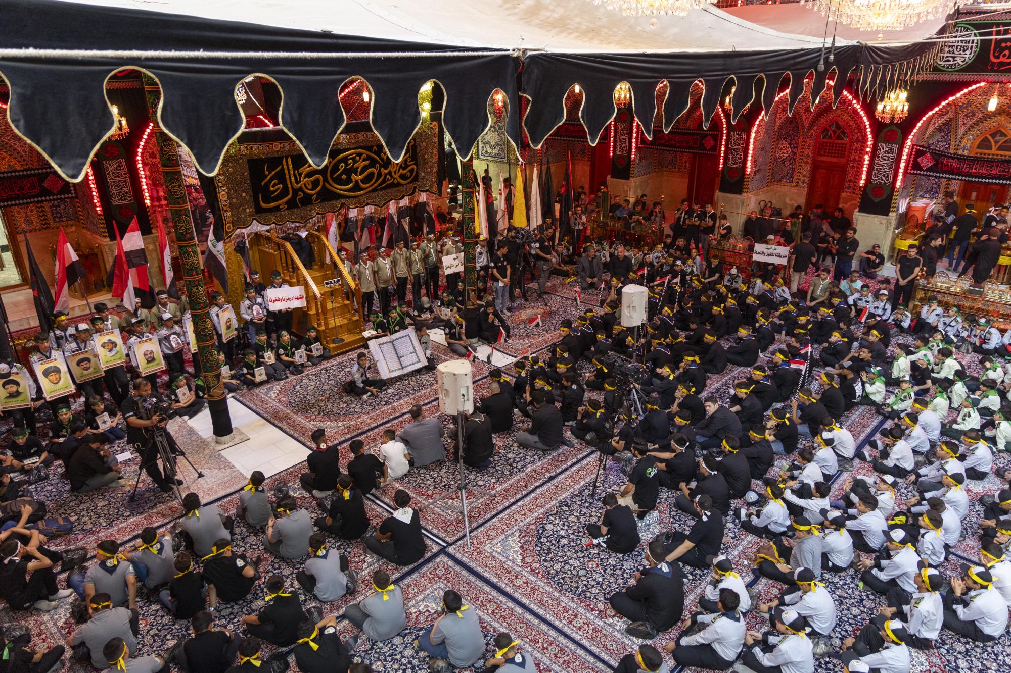 Members of "Al-Kafil" group of Hazrat Abbas Shrine hold Hosseini procession