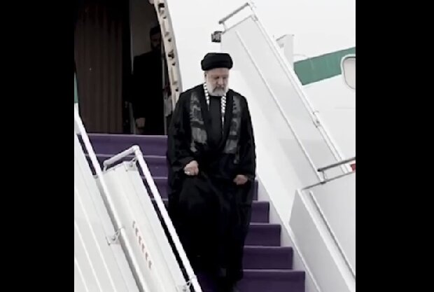 Sayyid Ibrahim Raeisi and wearing a Palestinian scarf