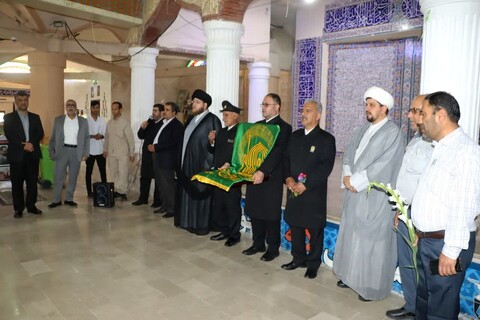 تصاویر/ ادای احترام خادمان امام رضا(ع) به شهدای بوشهر