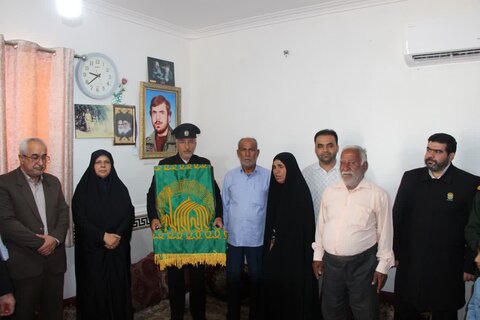 تصاویر/ تجلیل از مادر شهید تاج الدین توسط خدام رضوی