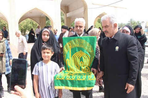 تصاویر/ ادای احترام خادمان رضوی به شهدا در شهر کلمه