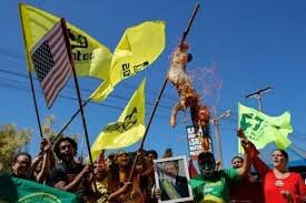 Angry Brazilians Burn U.S. Flag and Trump Effigy