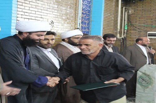 تجلیل از ایثارگران و قهرمانان ورزشی در بیستون