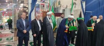 تجلیل از خانواده شهدای جنگ رمضان و جنگ ۱۲روزه در ملایر+عکس