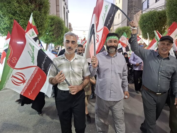 تصاویر/ کاشانی ها بیش از ۵۰۰ پرچم مشترک ایران و عراق را در کربلای معلا توزیع کردند