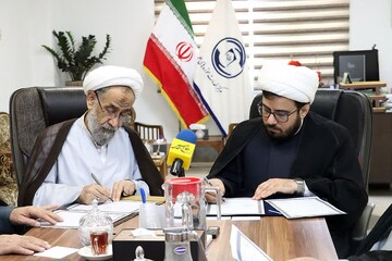 امضای تفاهم‌نامه مرکز خدمات حوزه‌ و سازمان نشر آثار و ارزش‌های مشارکت روحانیت در دفاع مقدس + عکس