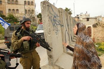 Israeli Troops Assault a Palestinian Woman after Invading Her Home