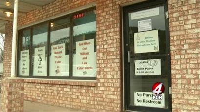  US business under fire for  racist signs​ 